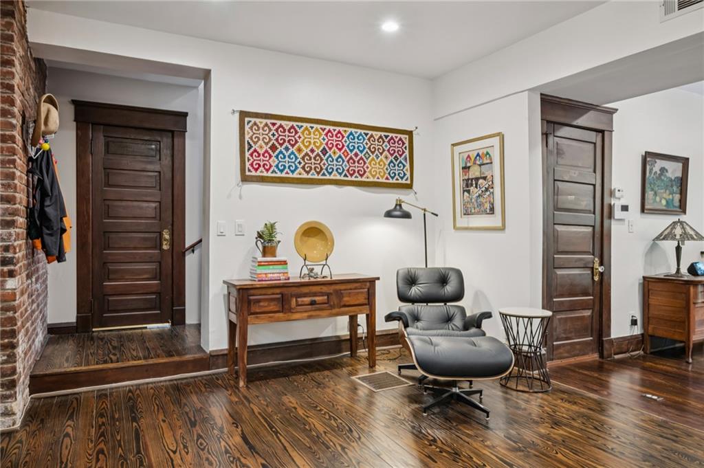 926 Waverly Way Northeast, Unit F Atlanta, GA 30307 - Photo 3 of 33 a living room with furniture and a wooden floor