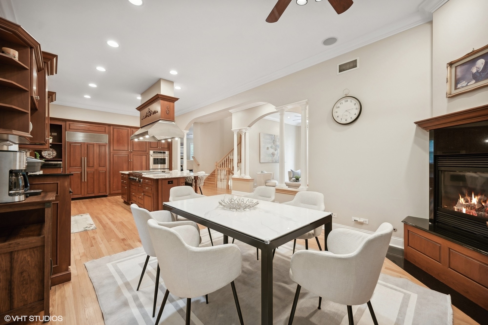 41 Scott Loop Highland Park, IL 60035 - Photo 13 of 50 a view of a dining room with furniture and a fireplace
