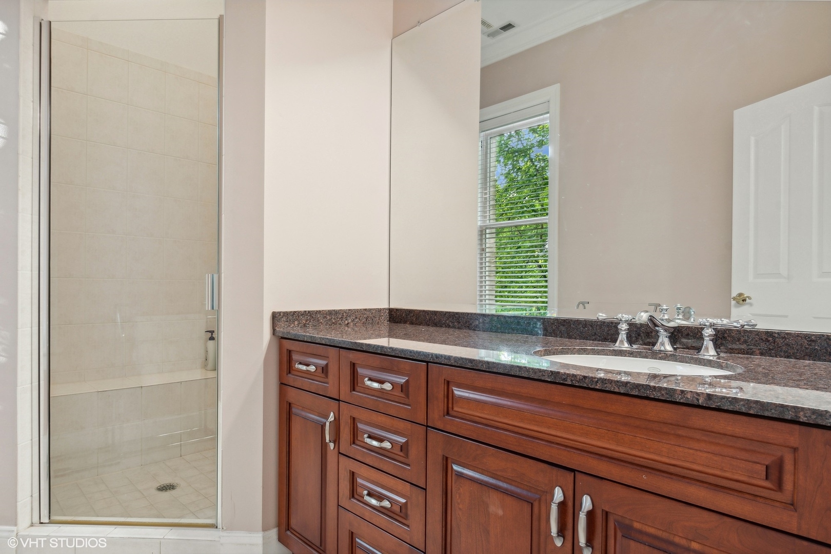 41 Scott Loop Highland Park, IL 60035 - Photo 30 of 50 a bathroom with a granite countertop sink and a window