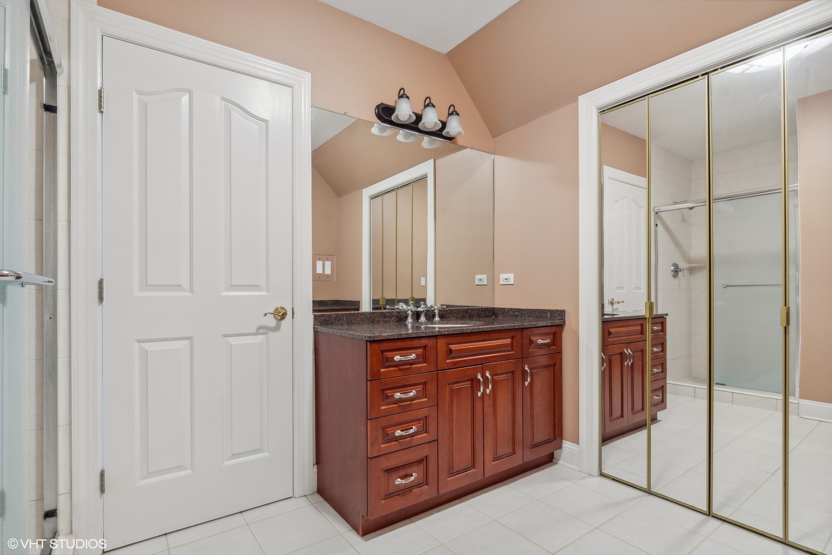 41 Scott Loop Highland Park, IL 60035 - Photo 34 of 50 a bathroom with a granite countertop sink a mirror and a shower