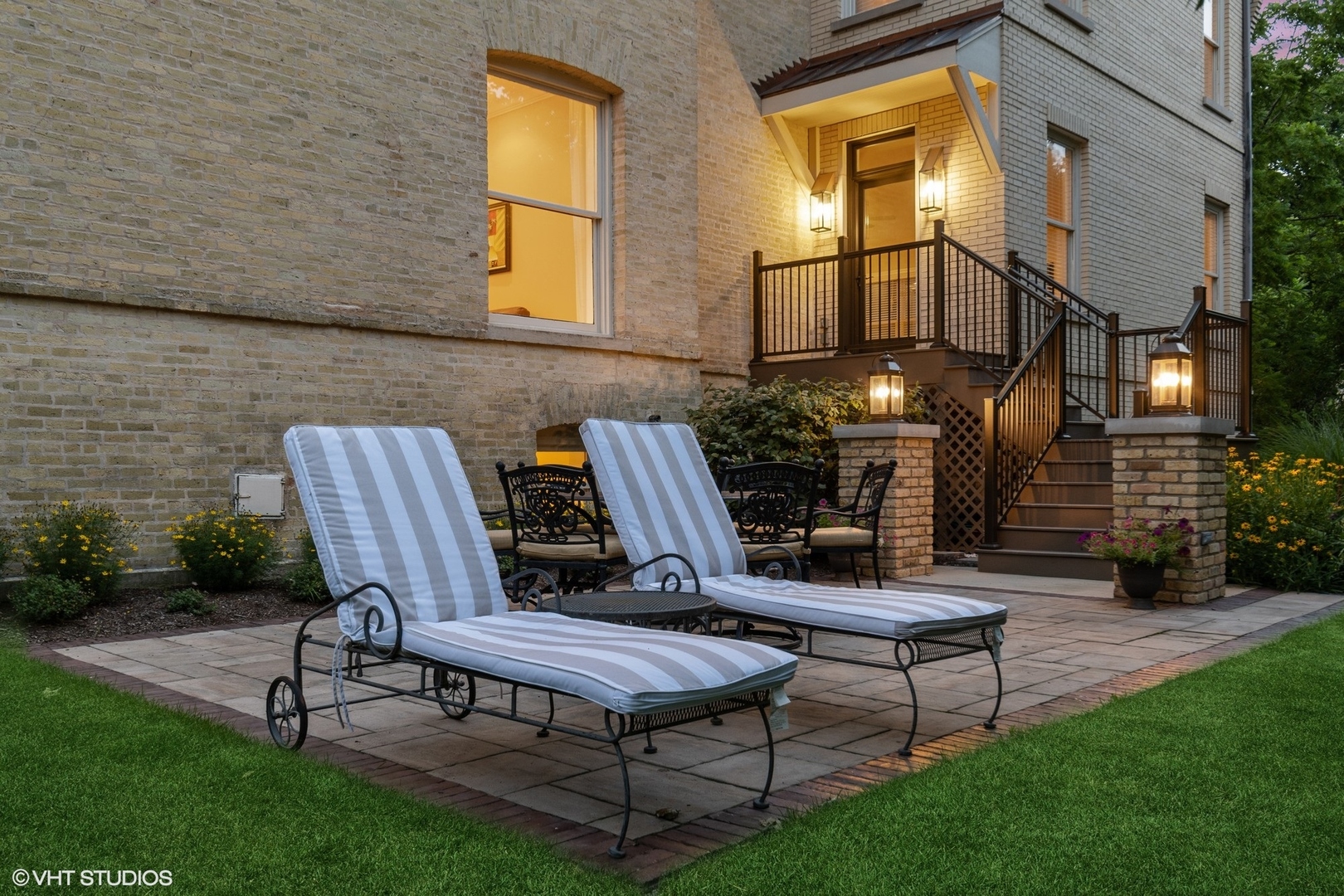 41 Scott Loop Highland Park, IL 60035 - Photo 43 of 50 a view of a patio with table and chairs with wooden fence and plants