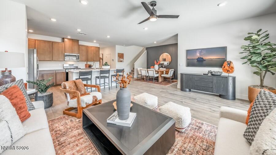 4302 Painted Cloud Way Sparks, NV 89436 - Photo 14 of 30 a living room with fireplace furniture and a potted plant