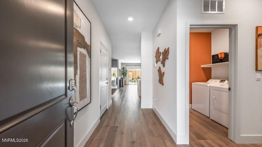 4302 Painted Cloud Way Sparks, NV 89436 - Photo 2 of 30 a view of a hallway with bathroom and wooden floor