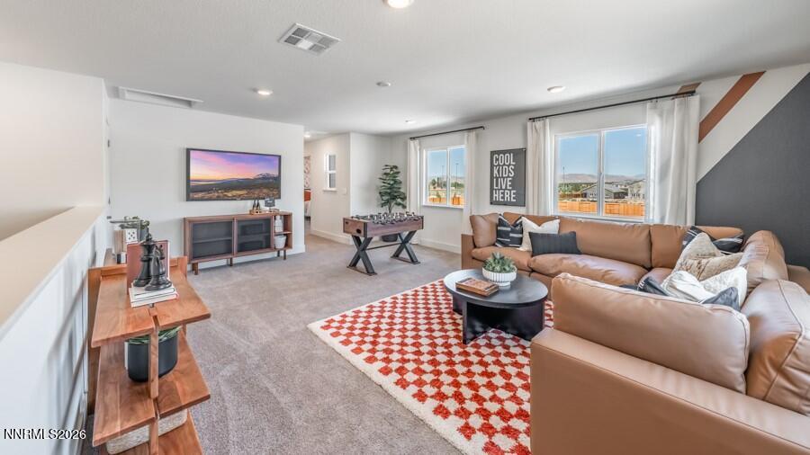 4302 Painted Cloud Way Sparks, NV 89436 - Photo 23 of 30 a living room with furniture a rug and a flat screen tv