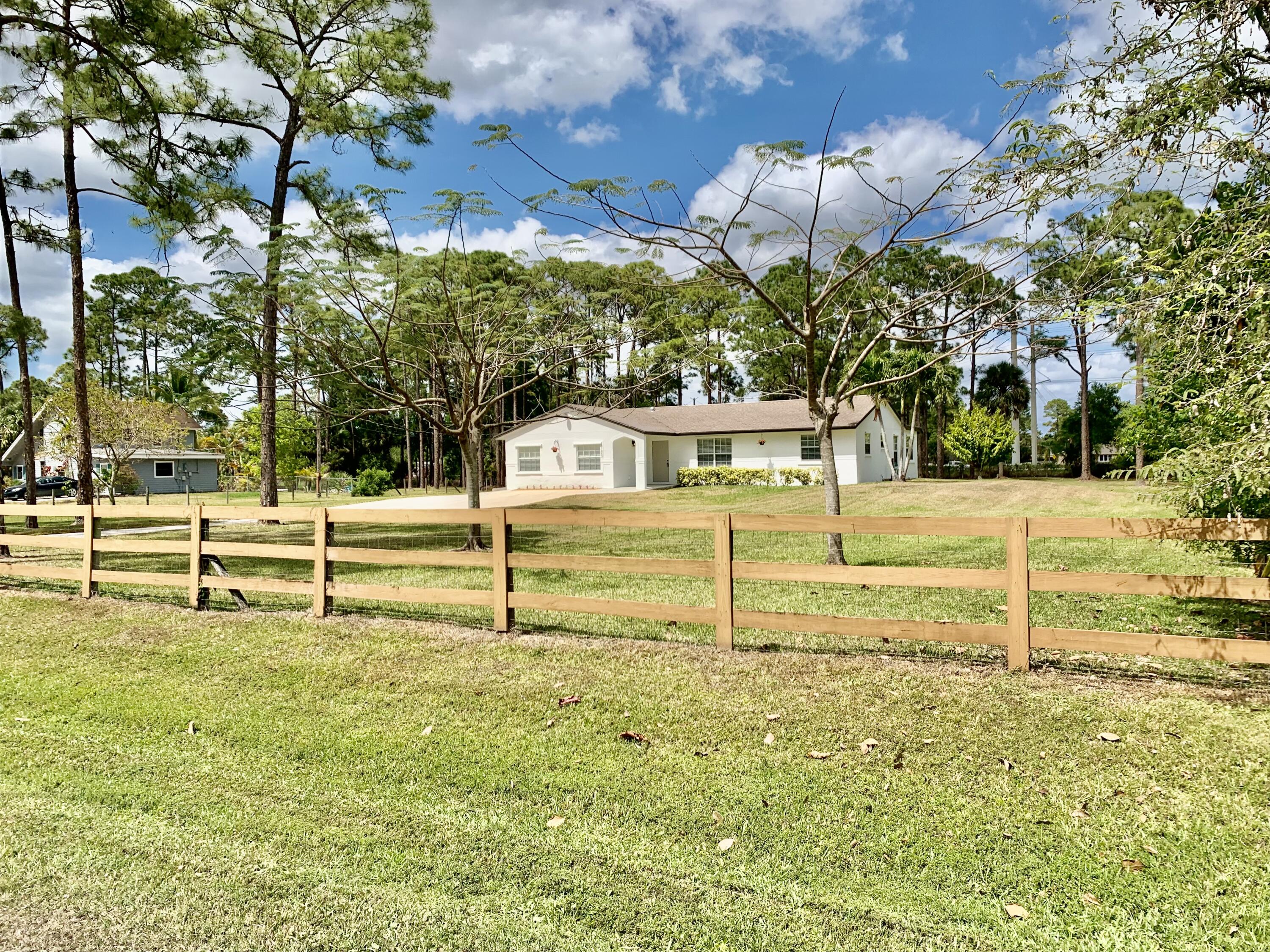 11853 47th Road North The Acreage, FL 33411 - Photo 1 of 22 Front 60