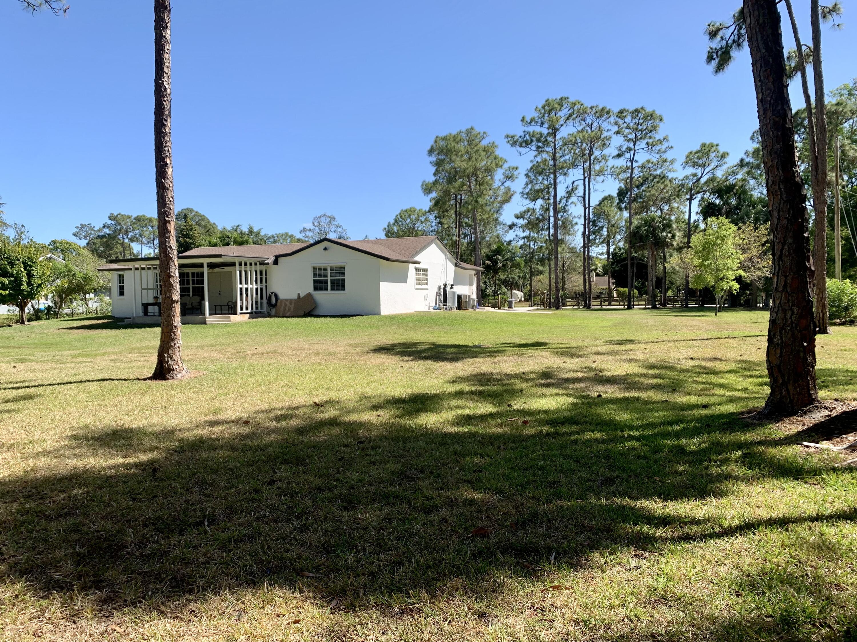11853 47th Road North The Acreage, FL 33411 - Photo 17 of 22 Rear House 9