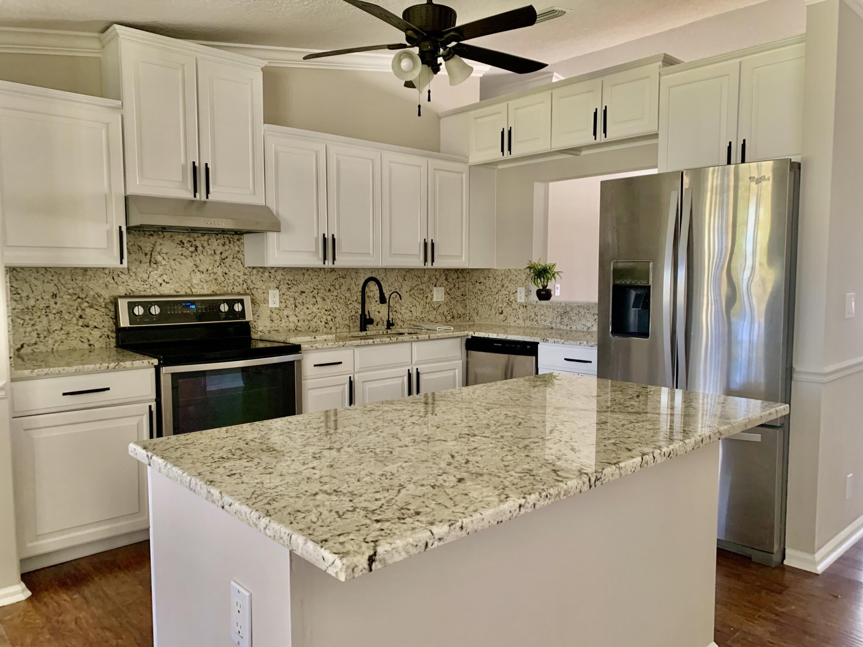 11853 47th Road North The Acreage, FL 33411 - Photo 7 of 22 Kitchen 32