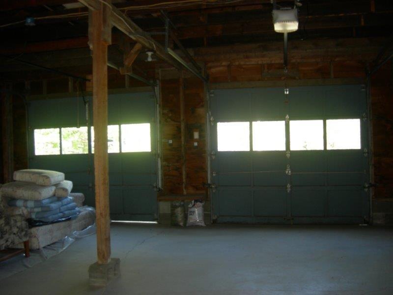 550 East Side Road Hancock, ME 04640 - Photo 12 of 17 Garage doors opening onto the gravel...