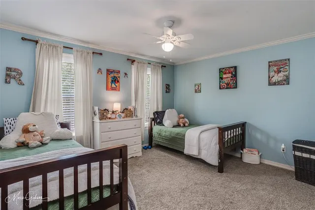 a bedroom with furniture and a chandelier