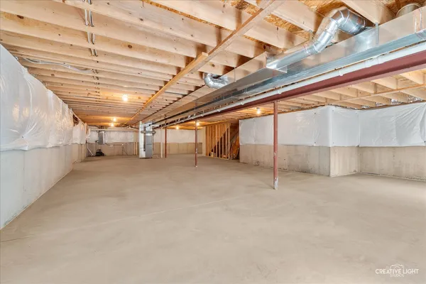 a view of a field with trees in the background