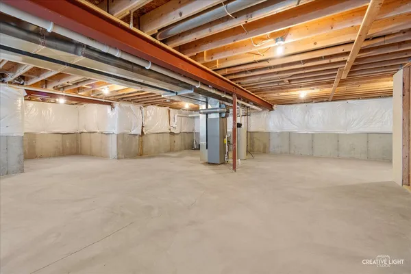 a view of a brick house with potted plants