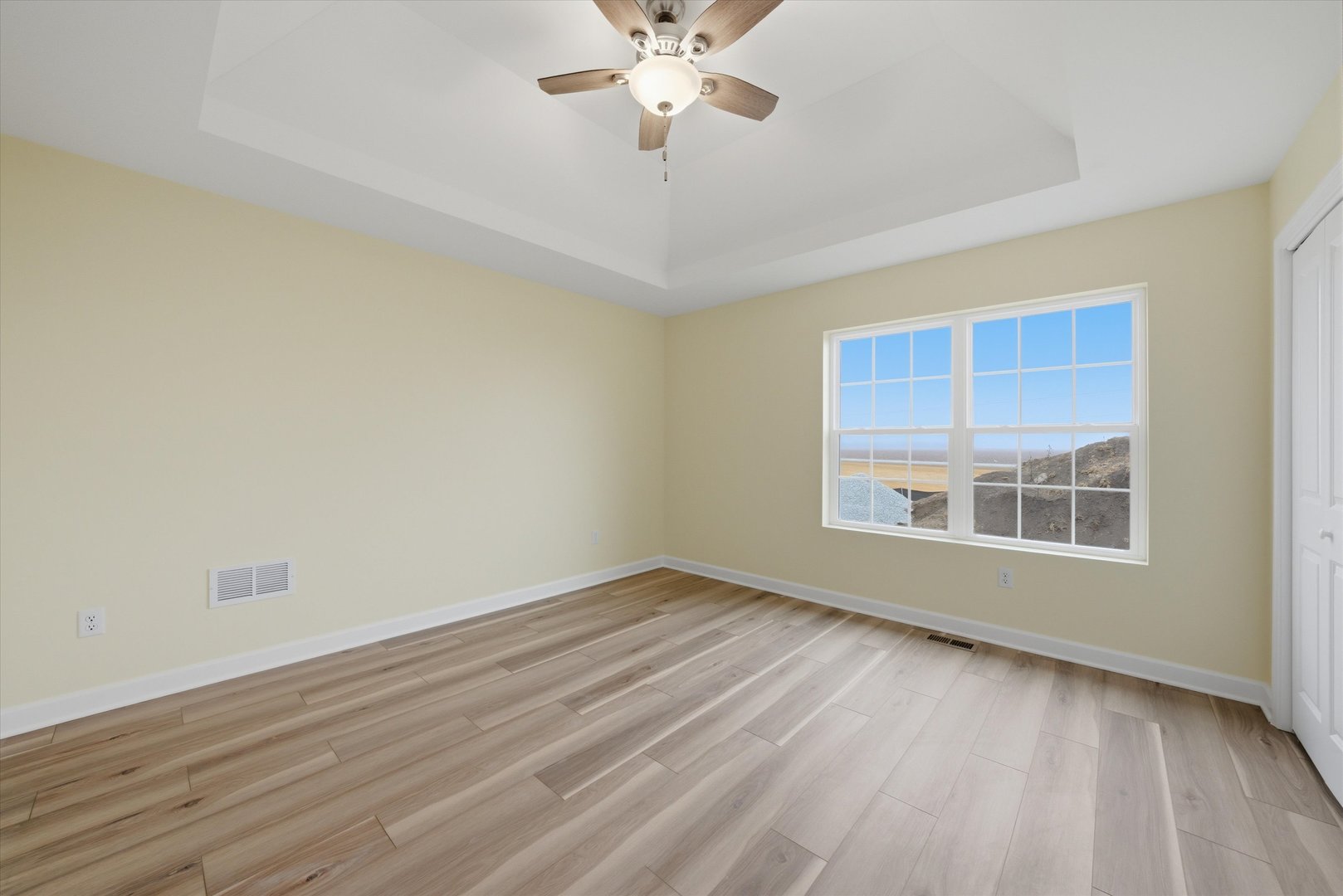 477 Emma Drive Manteno, IL 60950 - Photo 13 of 29 a view of an empty room with wooden floor and a window
