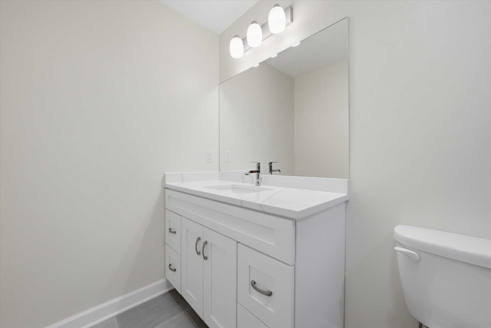 477 Emma Drive Manteno, IL 60950 - Photo 21 of 29 a bathroom with a sink a toilet and a mirror