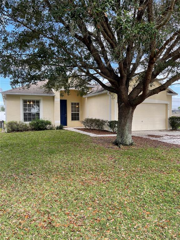 606 Sunset View Drive Davenport, FL 33837 - Photo 1 of 30 a house view with a garden space