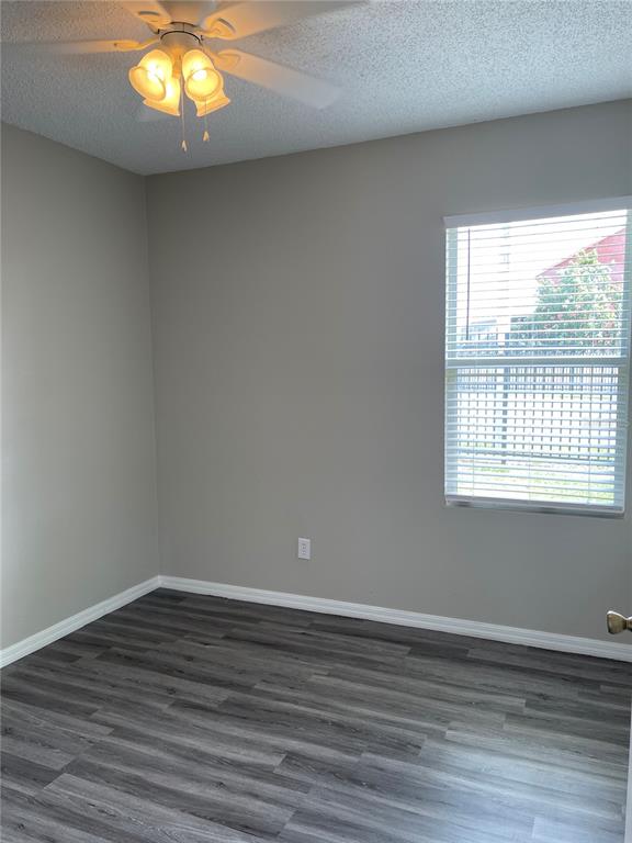 606 Sunset View Drive Davenport, FL 33837 - Photo 16 of 30 a view of an empty room with wooden floor and a window