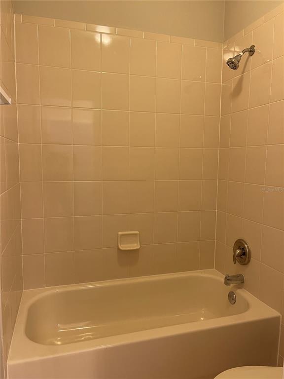 606 Sunset View Drive Davenport, FL 33837 - Photo 26 of 30 a bathroom with a bathtub