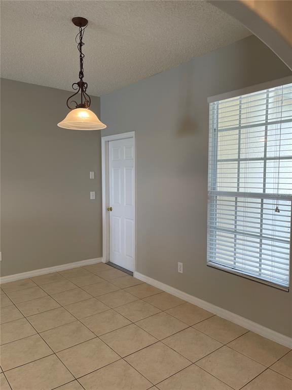606 Sunset View Drive Davenport, FL 33837 - Photo 7 of 30 a view of an empty room with a window