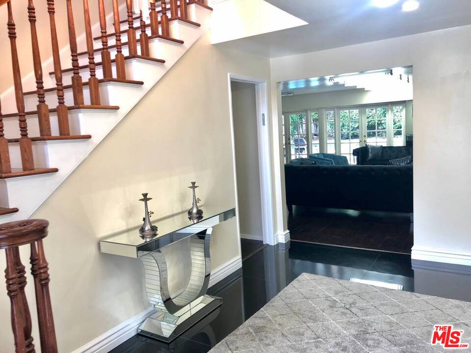 9601 Heather Road Beverly Hills, CA 90210 - Photo 14 of 21 a view of entryway and hall with wooden floor