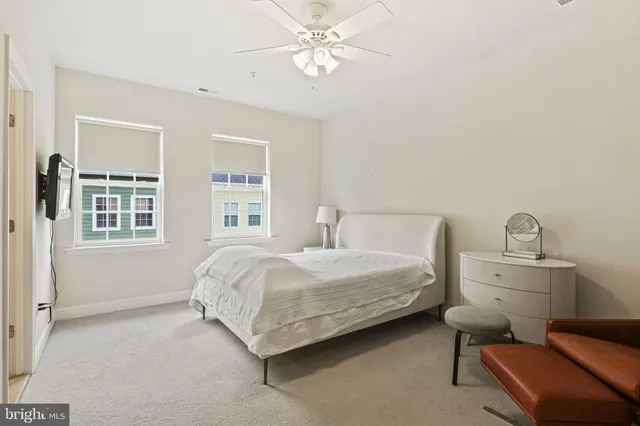 a bedroom with bed and window