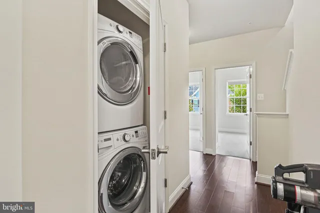 a view of a hallway with washer and dryer