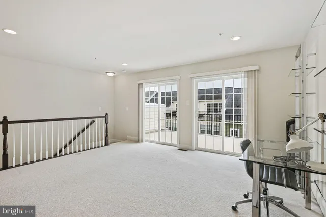 a view of a livingroom with furniture and a window