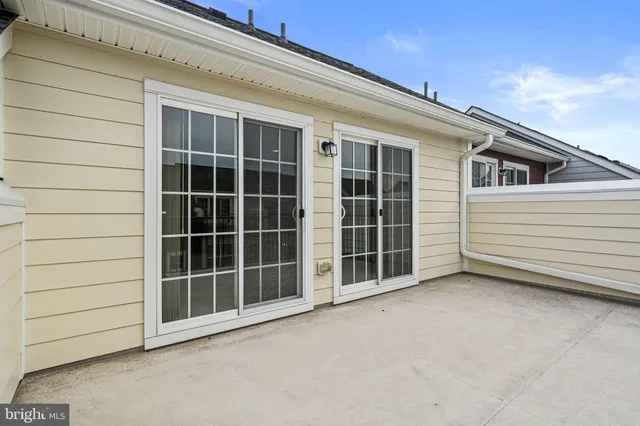 a view of an empty room with a balcony