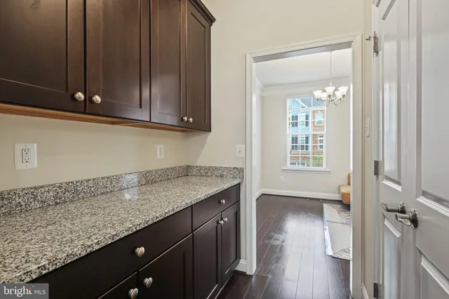 a view of a kitchen cabinets and wooden floor