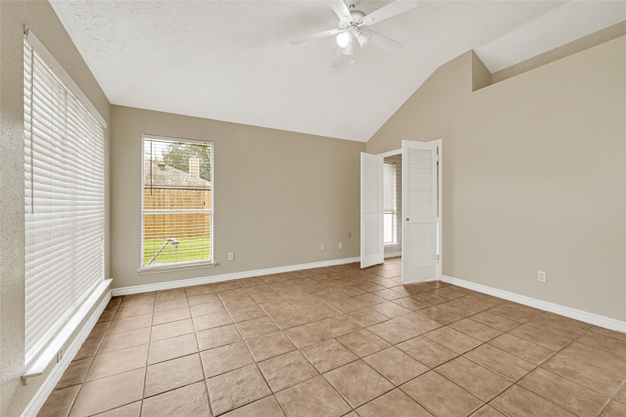 12322 Meadow Ridge Drive Stafford, TX 77477 - Photo 17 of 39 a view of an empty room with a window