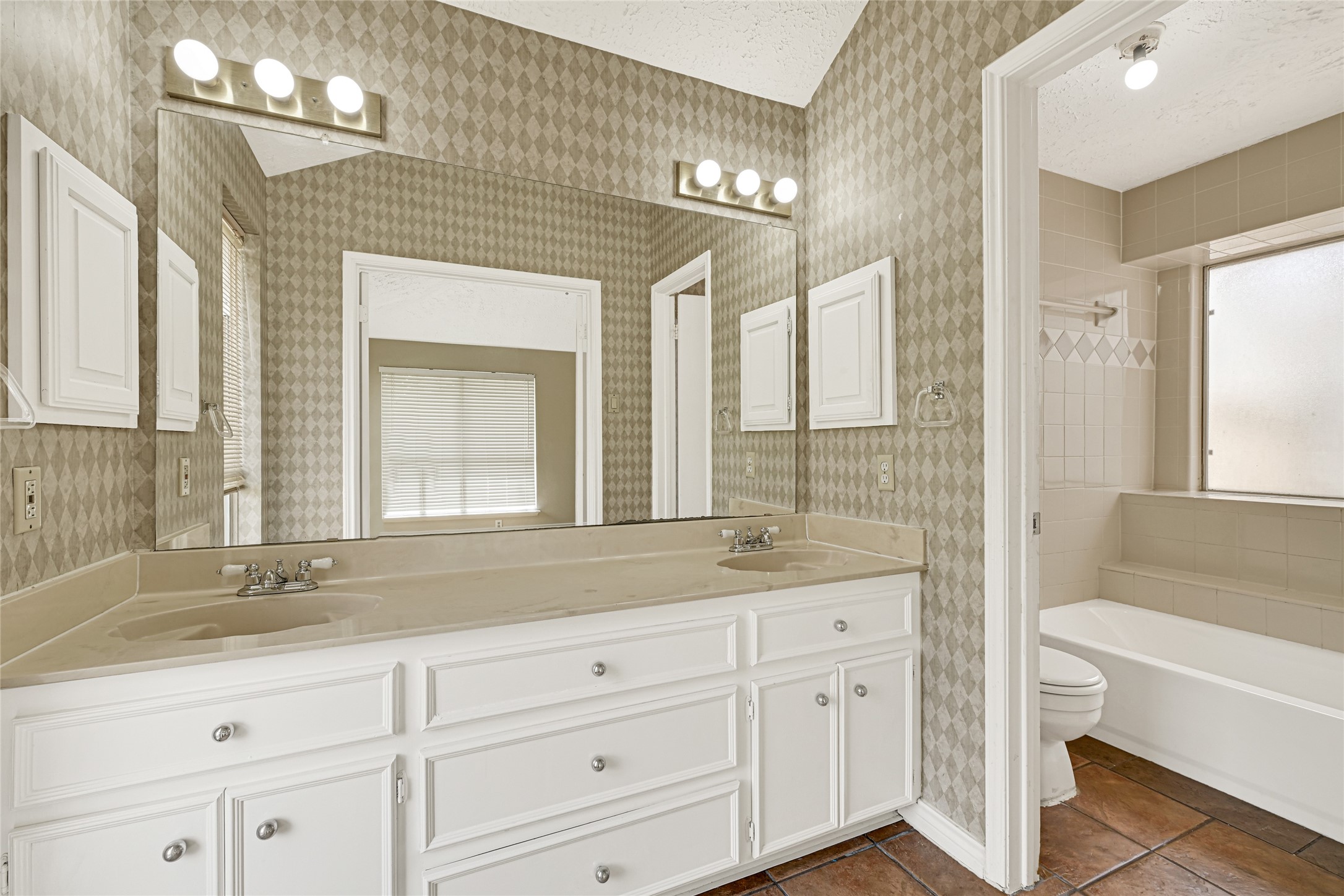 12322 Meadow Ridge Drive Stafford, TX 77477 - Photo 19 of 39 a bathroom with a granite countertop sink mirror and bathtub