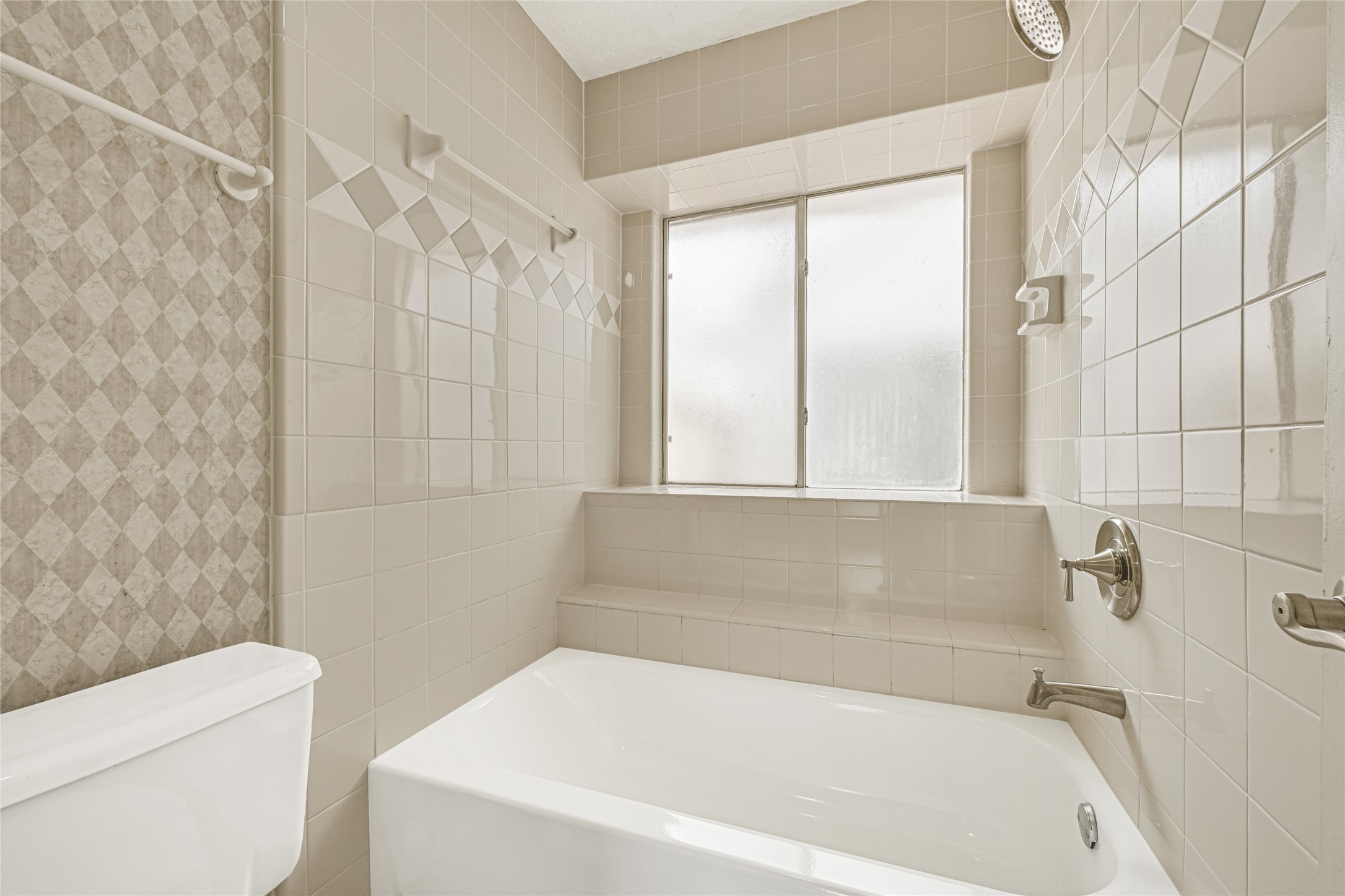 12322 Meadow Ridge Drive Stafford, TX 77477 - Photo 20 of 39 a white bath tub sitting next to a white toilet and a shower