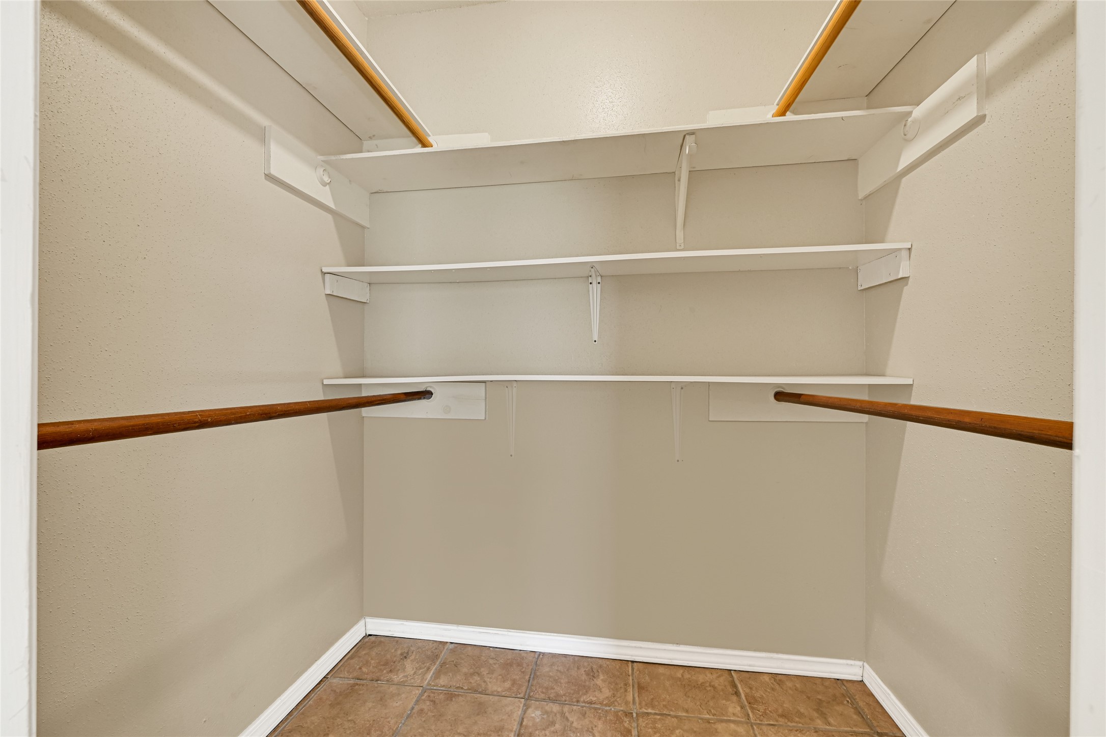 12322 Meadow Ridge Drive Stafford, TX 77477 - Photo 21 of 39 a view of an empty walk in closet