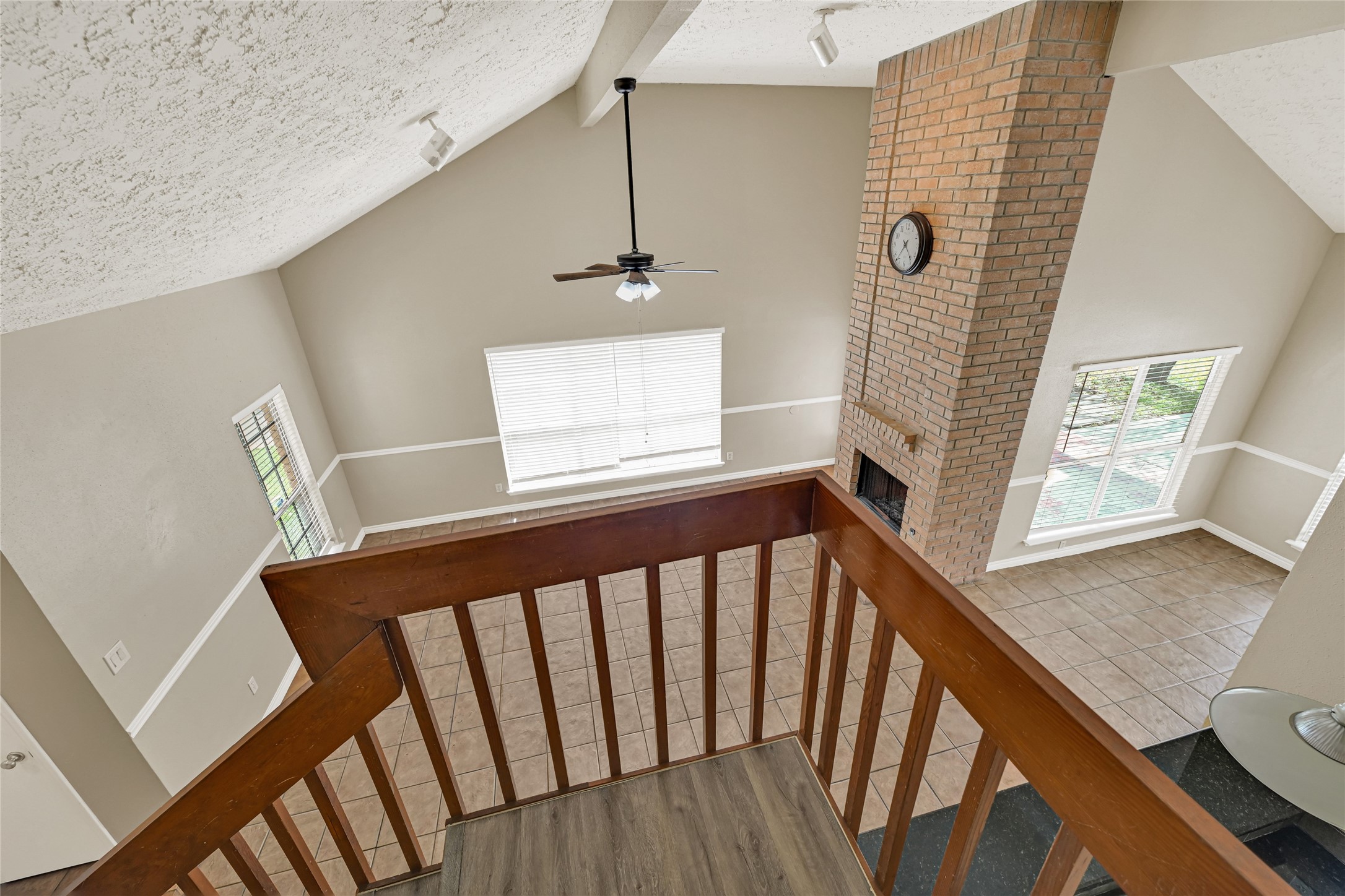 12322 Meadow Ridge Drive Stafford, TX 77477 - Photo 22 of 39 a view of a hallway with wooden floor and stairs