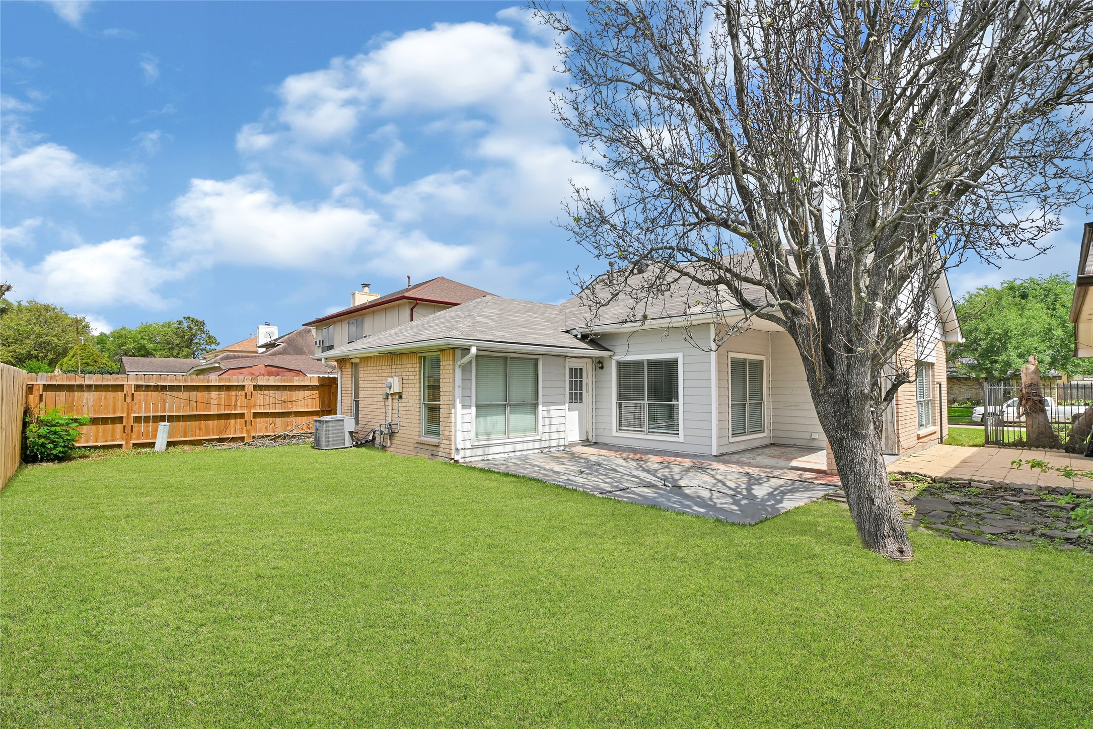 12322 Meadow Ridge Drive Stafford, TX 77477 - Photo 31 of 39 Large covered patio overlooking the huge backyard side yard