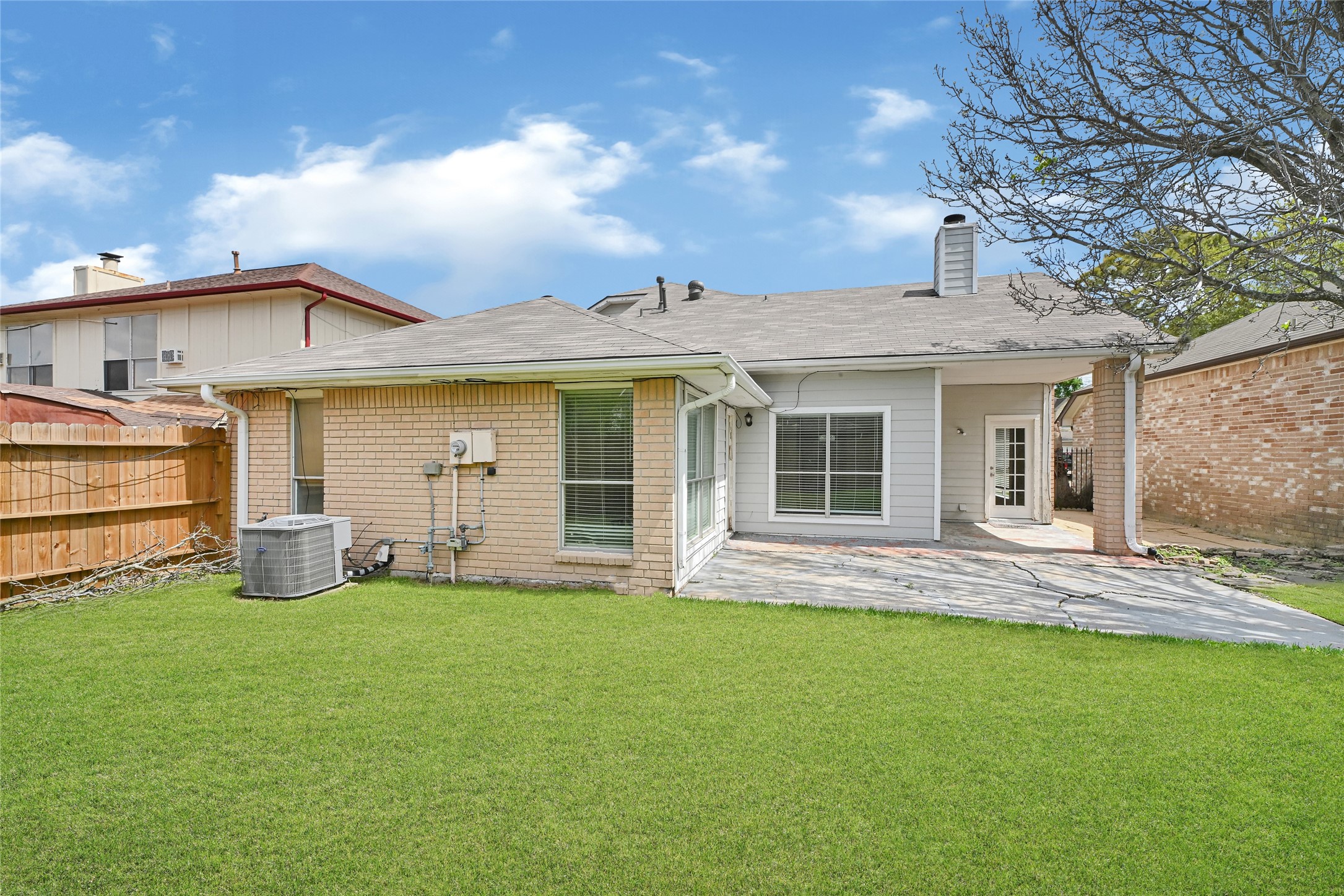12322 Meadow Ridge Drive Stafford, TX 77477 - Photo 32 of 39 a front view of a house with a garden and yard