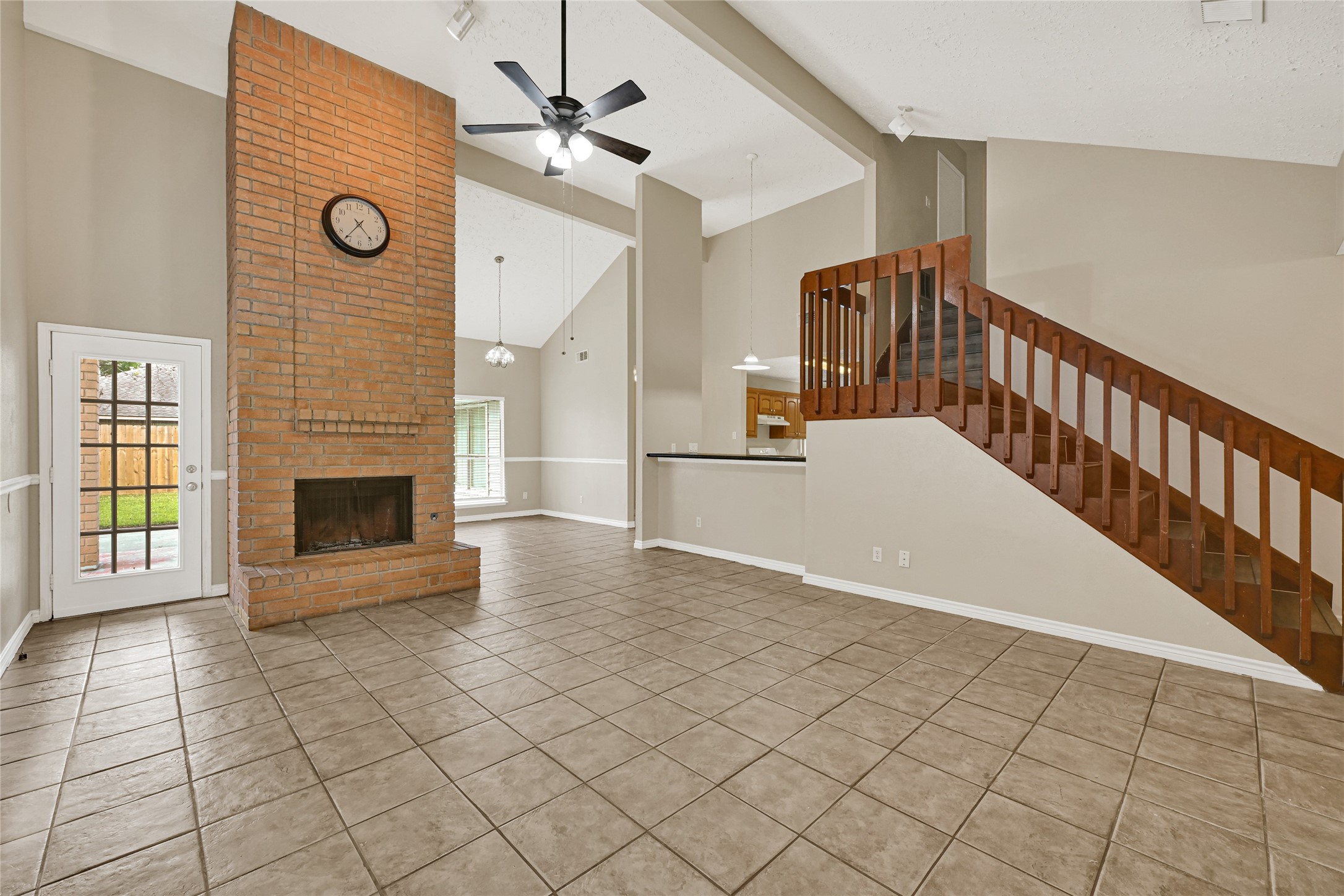 12322 Meadow Ridge Drive Stafford, TX 77477 - Photo 7 of 39 a view of a livingroom with a staircase and a fireplace