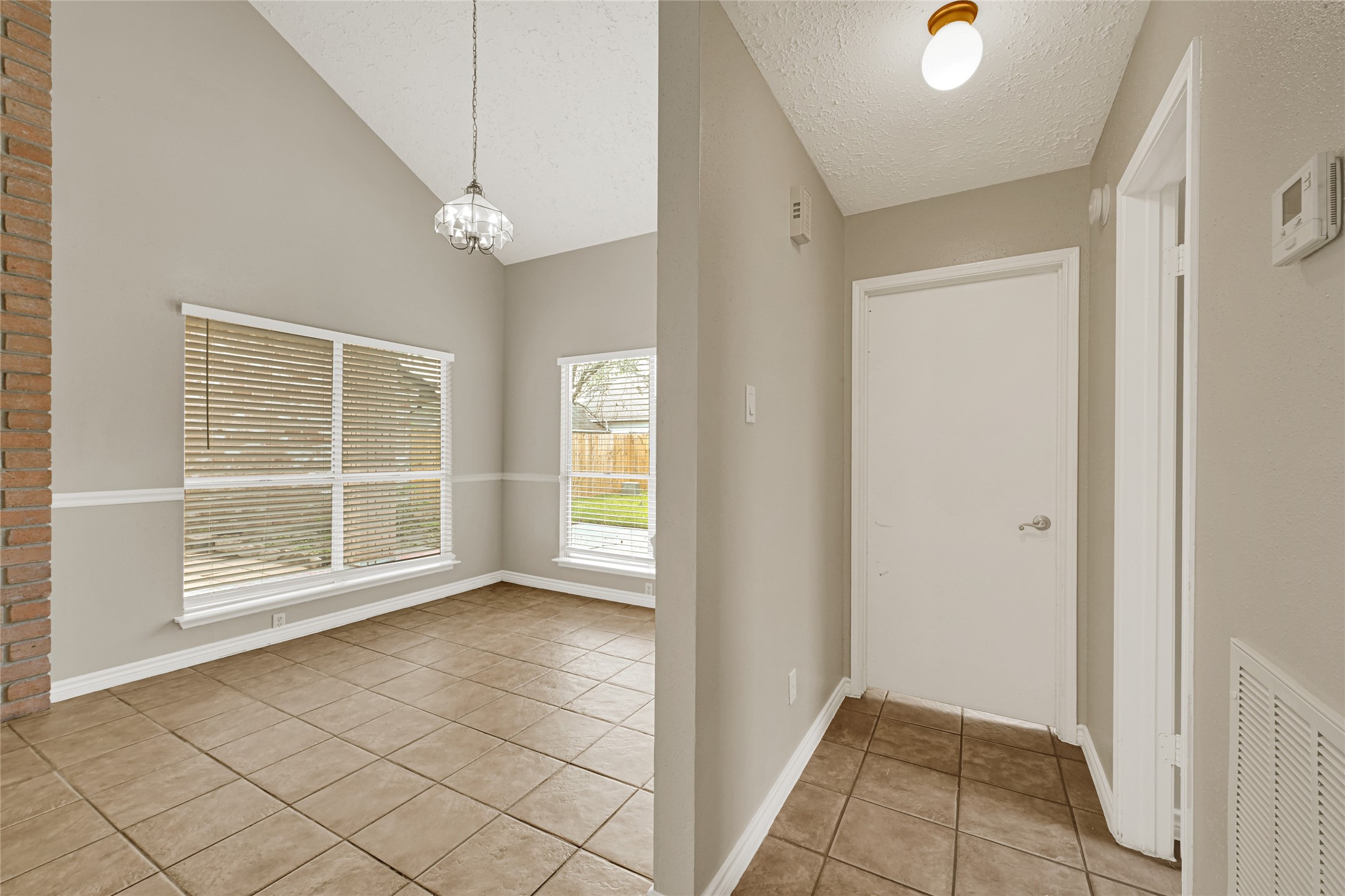 12322 Meadow Ridge Drive Stafford, TX 77477 - Photo 9 of 39 a view of an empty room with glass door
