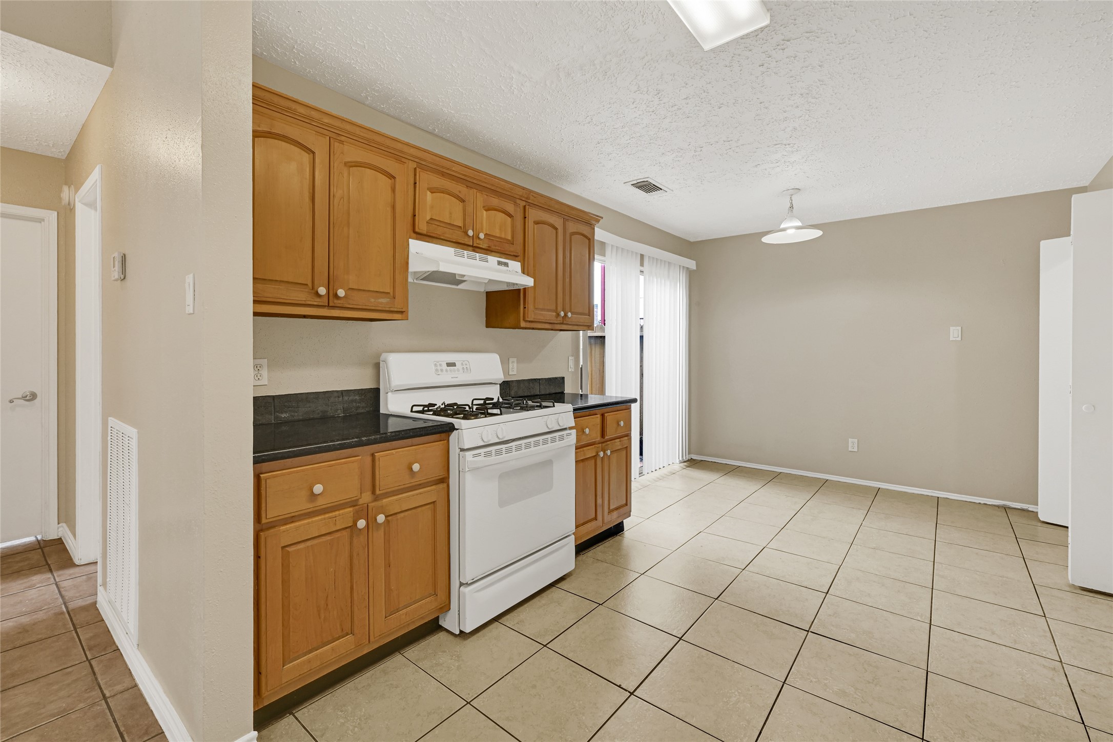 12322 Meadow Ridge Drive Stafford, TX 77477 - Photo 10 of 39 a kitchen with stainless steel appliances granite countertop a refrigerator sink and cabinets