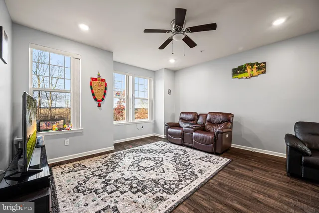 a living room with couch and a window