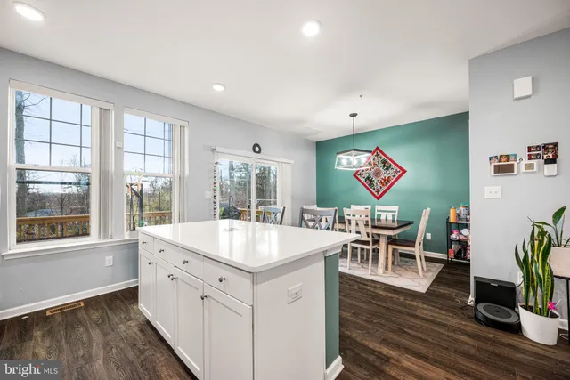 a very nice looking dining room with a large window