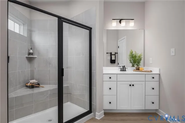 a bathroom with a shower and a sink