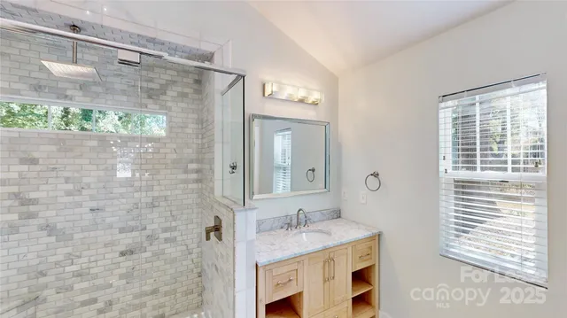 a view of a livingroom with wooden floor and a window