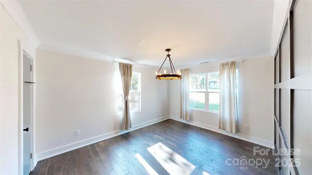 a bathroom with a granite countertop toilet a sink and a mirror