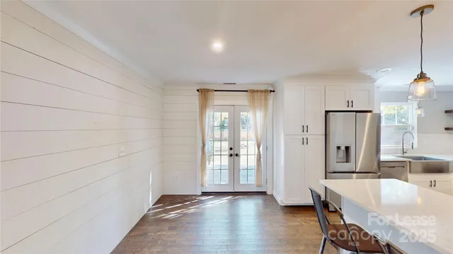 a view of a kitchen cabinets and wooden floor
