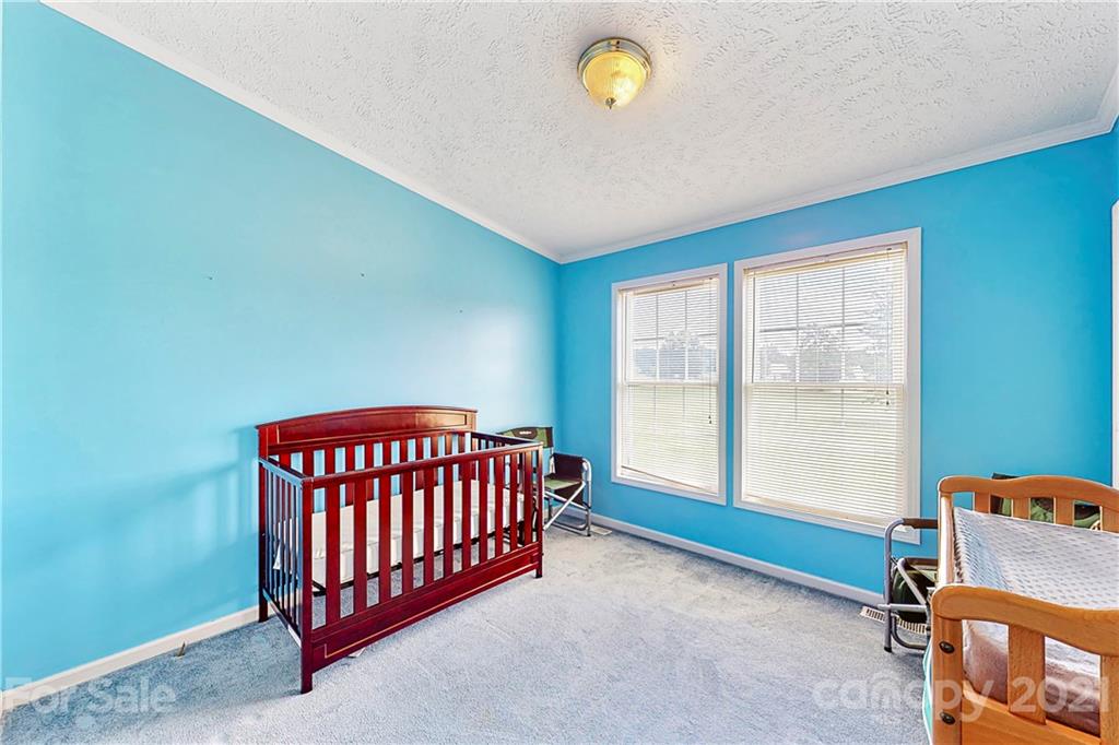4407 Wolf Pond Road Monroe, NC 28112 - Photo 13 of 26 a view of a room with a window and a ceiling fan