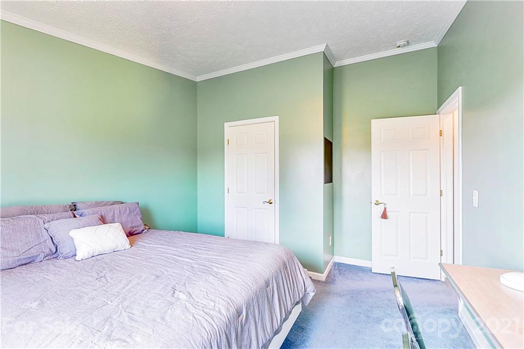 4407 Wolf Pond Road Monroe, NC 28112 - Photo 15 of 26 a bedroom with a bed and closet