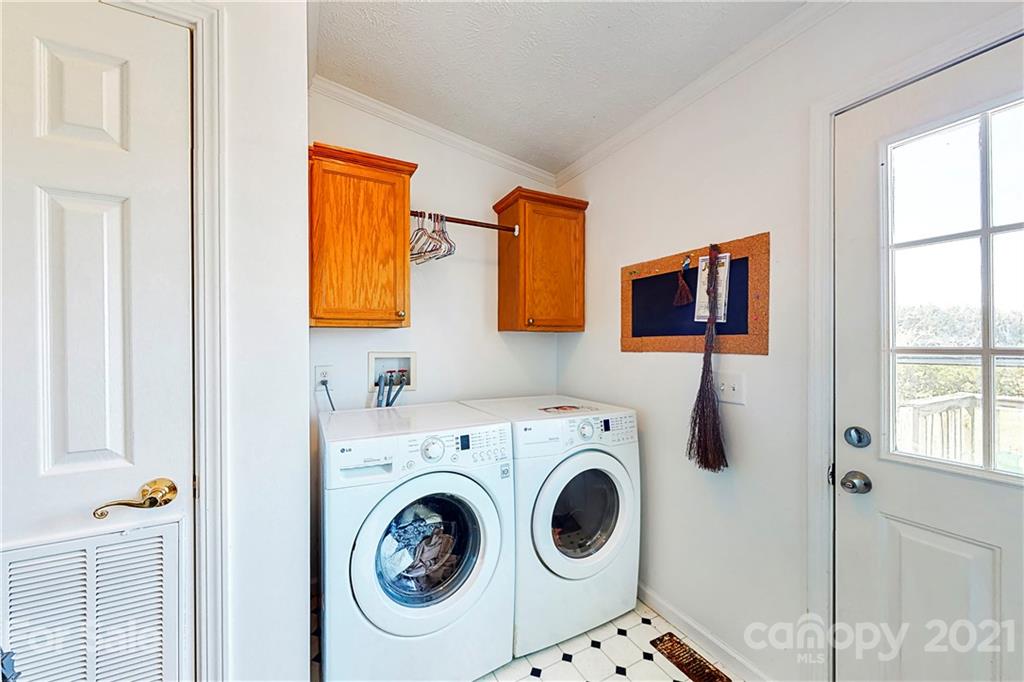 4407 Wolf Pond Road Monroe, NC 28112 - Photo 20 of 26 a utility room with dryer and washer