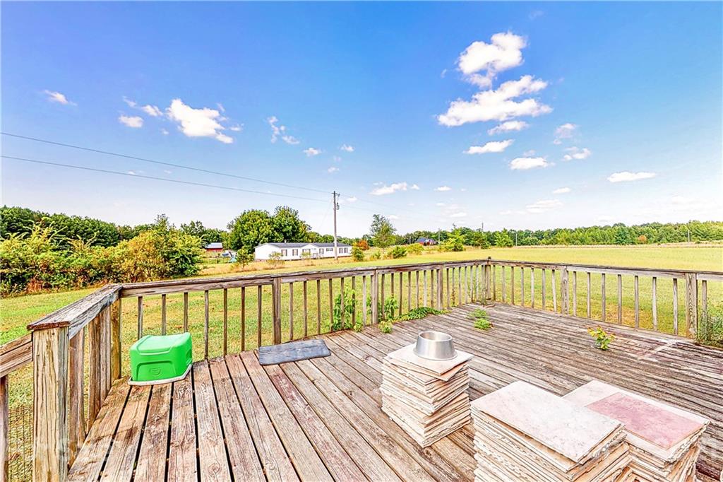 4407 Wolf Pond Road Monroe, NC 28112 - Photo 21 of 26 a view of a balcony with lake view and wooden floor