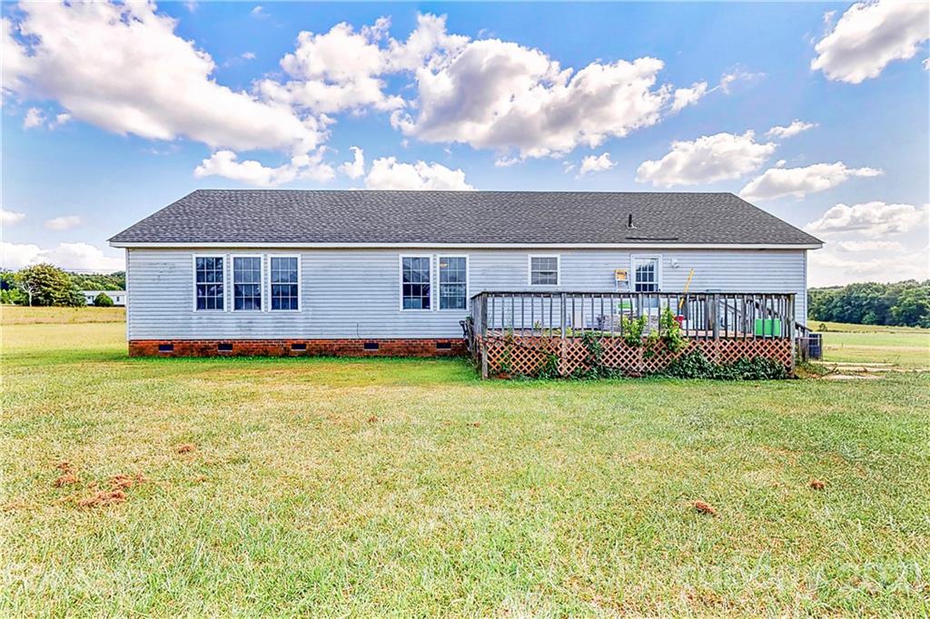 4407 Wolf Pond Road Monroe, NC 28112 - Photo 25 of 26 a view of a house with backyard and porch