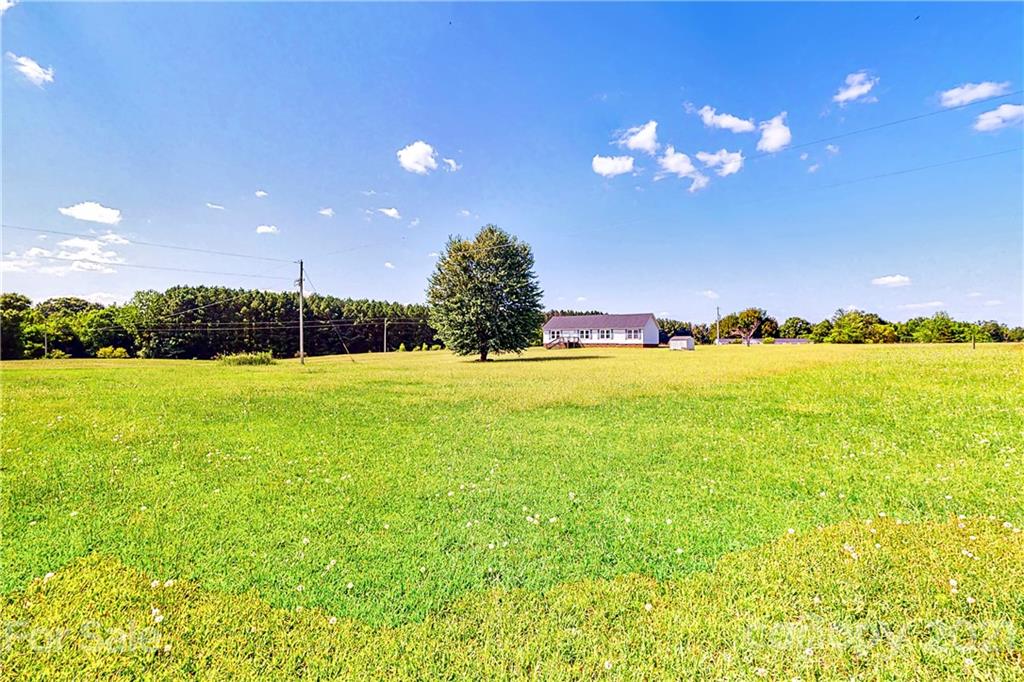 4407 Wolf Pond Road Monroe, NC 28112 - Photo 26 of 26 a view of an ocean and a yard