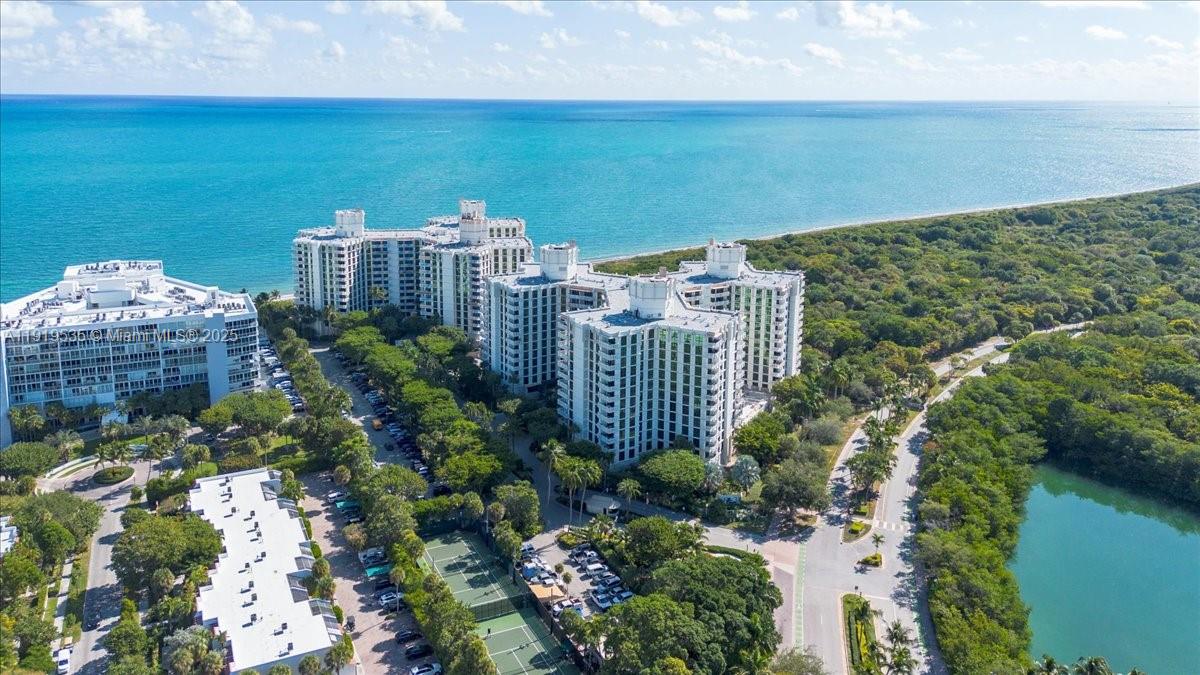 1121 Crandon Boulevard, Unit E304 Key Biscayne, FL 33149 - Photo 1 of 17 a view of a balcony with an outdoor space and seating area